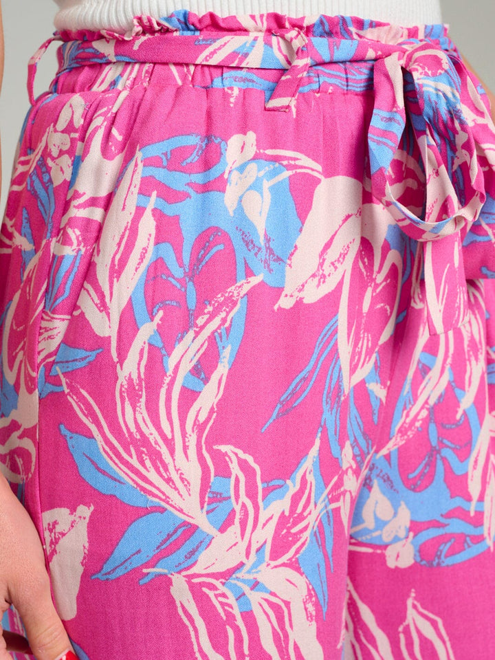 Pantalón fucsia con patron multicolor de pierna ancha