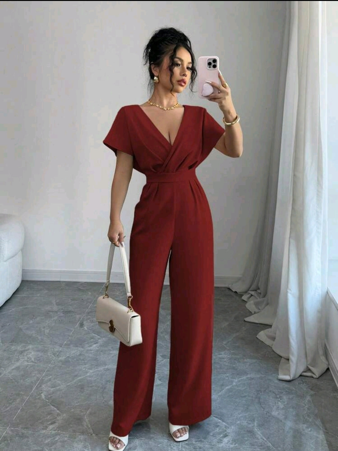 Jumpsuit rojo con pliegues a la cintura