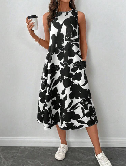 Vestido blanco y negro estilo midi línea A con estampado floral