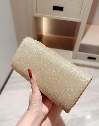Cartera para fiesta con lazo brillante