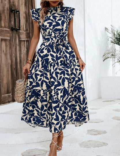 Vestido maxi beige con estampado floral azul
