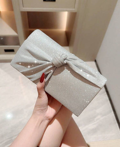 Cartera para fiesta con lazo brillante