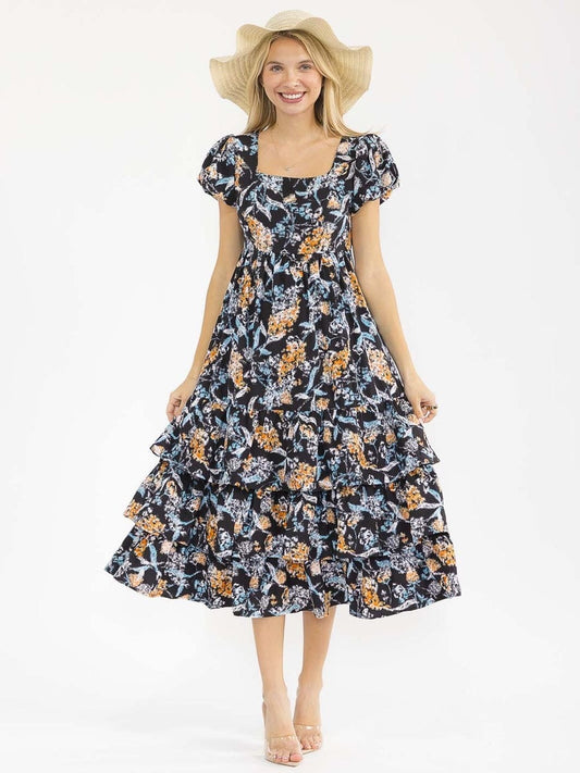 Vestido negro floral de vuelos