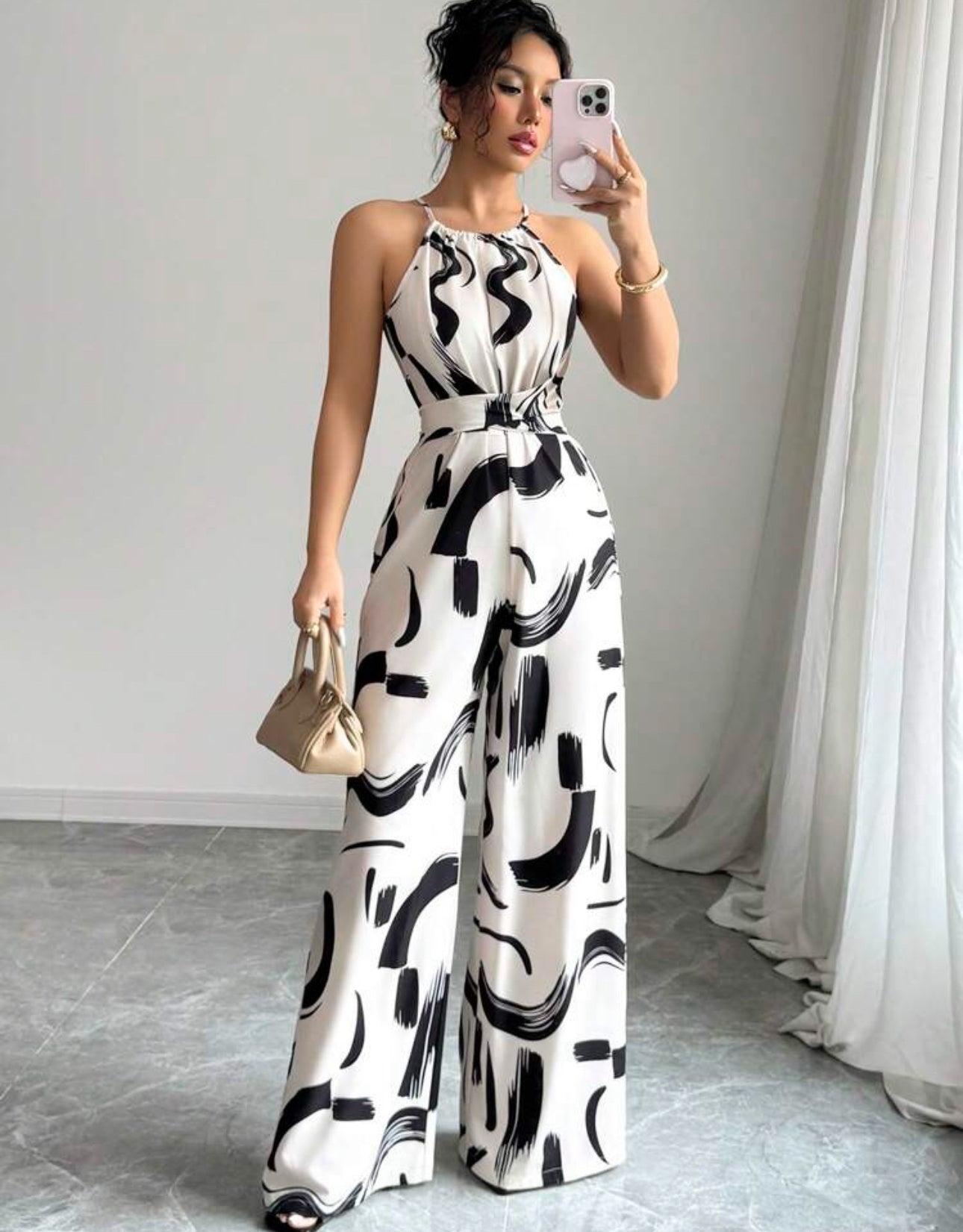 Jumpsuit beige con cinturón con estampado