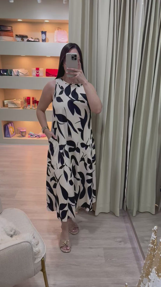 Vestido beige y negro con estampado floral