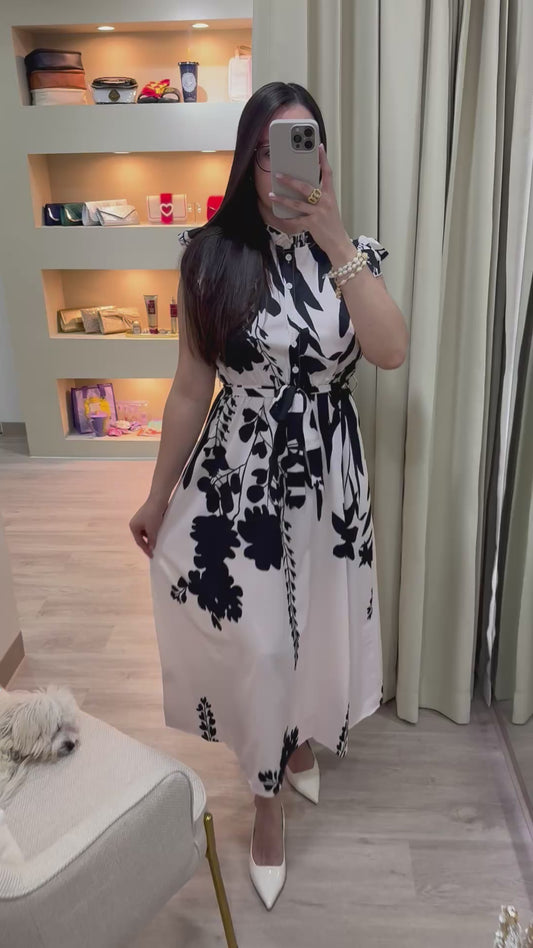 Vestido beige largo y elegante con estampado floral color negro