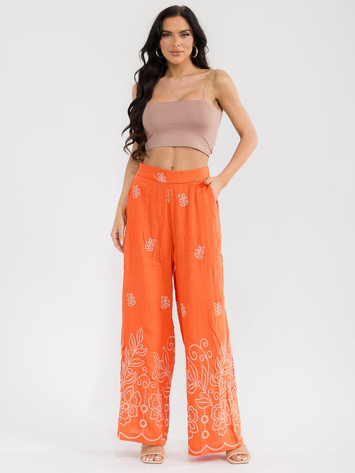 Pantalón palazzo naranja pierna ancha con estampado floral