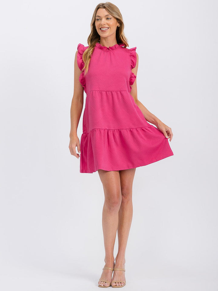Vestido mini fucsia con vuelos y bolsillos