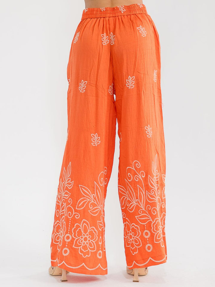 Pantalón palazzo naranja pierna ancha con estampado floral