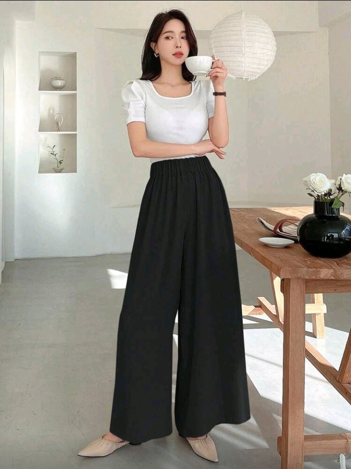 Pantalon negro ancho y relajado con cintura elástica