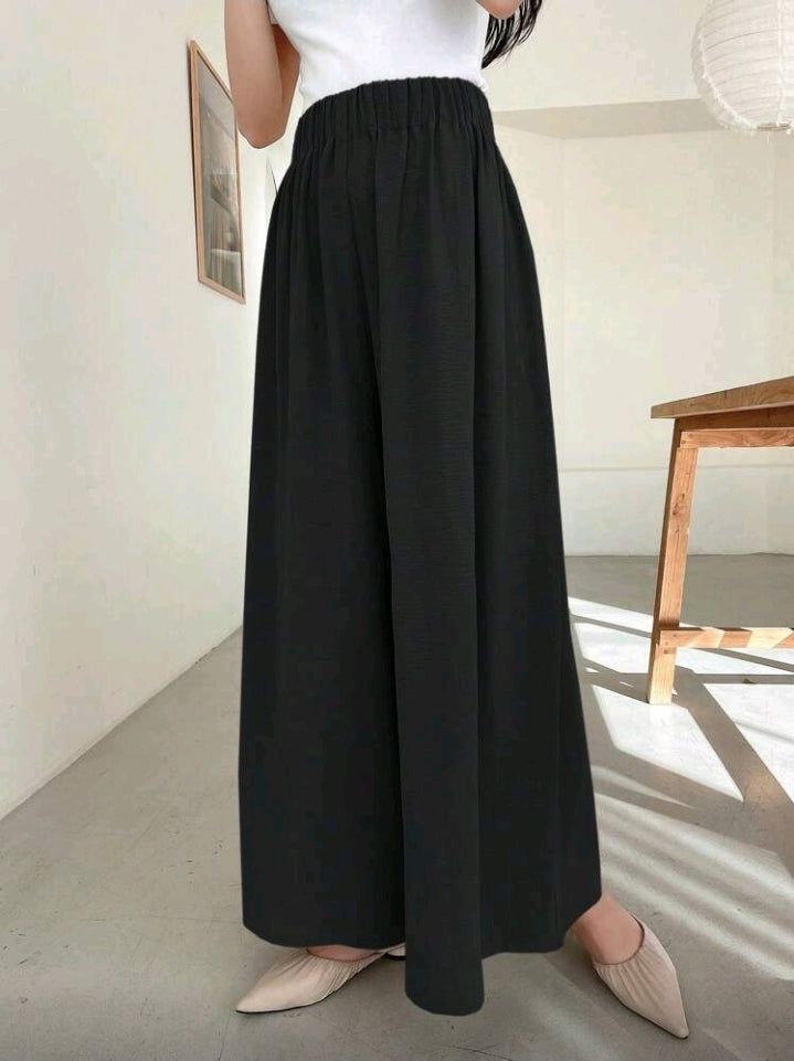Pantalon negro ancho y relajado con cintura elástica