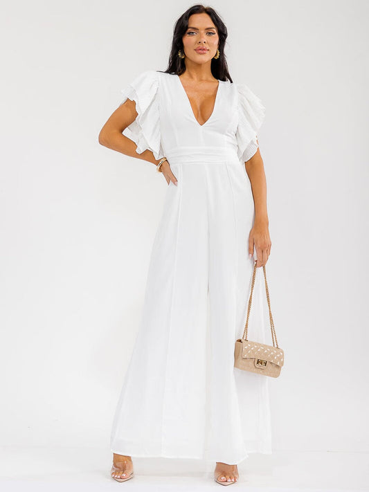 Jumpsuit blanco de pierna ancha con escote cruzado y mangas cortas con volantes