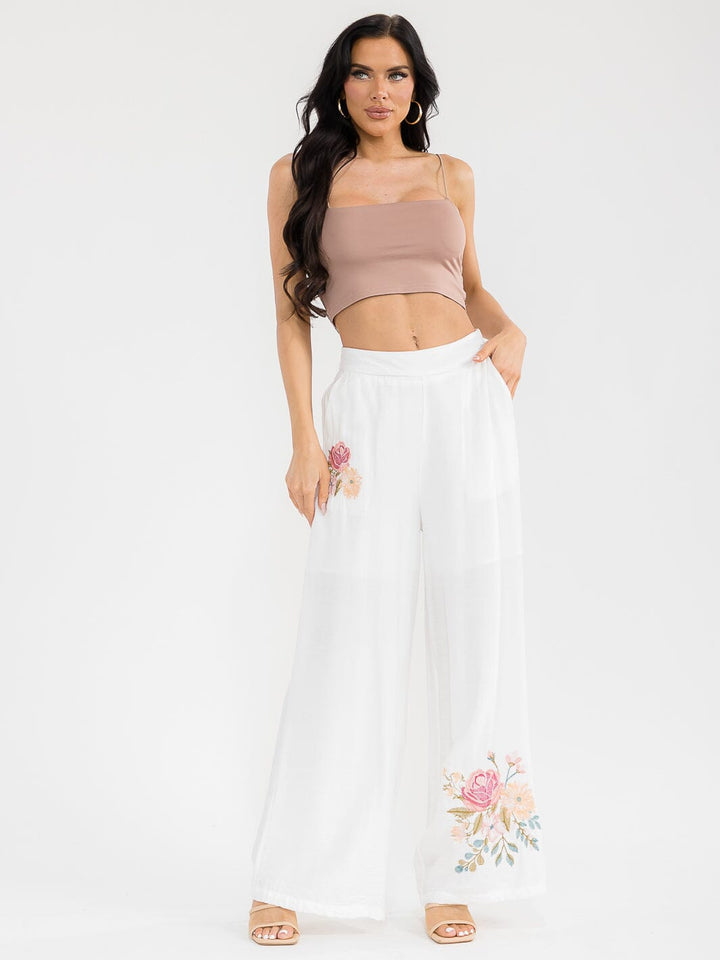Pantalón blanco palazzo de pierna ancha con bordado floral