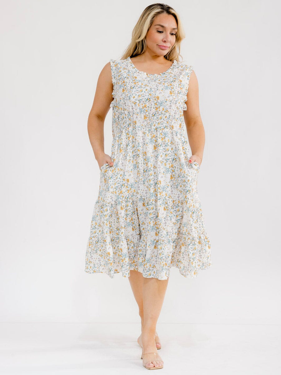 Vestido Plus blanco floral sin mangas y con bolsillos