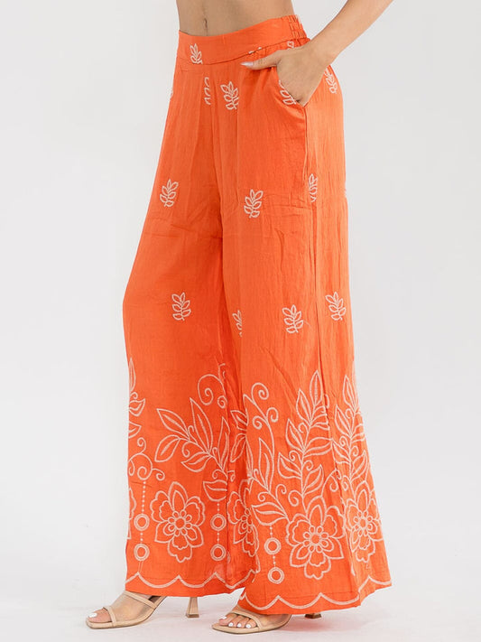 Pantalón palazzo naranja pierna ancha con estampado floral